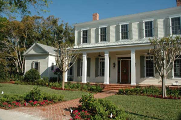 Early American house plans: Early American house plan exterior with a columned front porch, shuttered windows, and | Monster House Plans