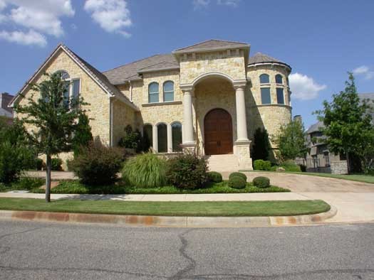 English Country house plans: European house plan interior foyer with a curved staircase and arched openings | Monster House Plans