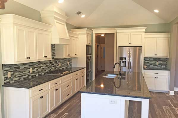 French Country house plans: French Country house plan interior kitchen with a center island and custom cabinetry | Monster House Plans