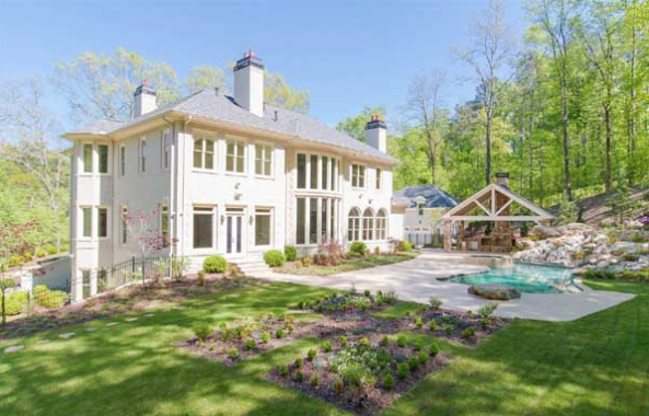 Georgian house plans: Georgian house plan exterior with a symmetrical facade, columned entry, and formal landscaping | Monster House Plans
