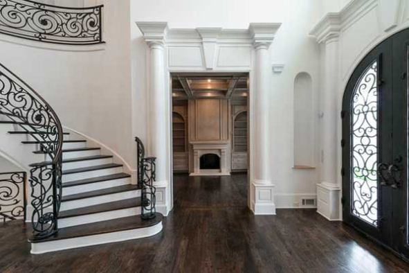 Georgian house plans: Georgian house plan interior foyer with a curved staircase and wrought iron railing | Monster House Plans