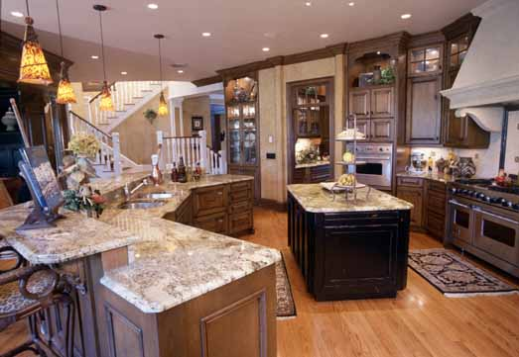 Greek Revival house plans: Greek Revival house plan interior kitchen with double islands and custom wood cabinetry | Monster House Plans