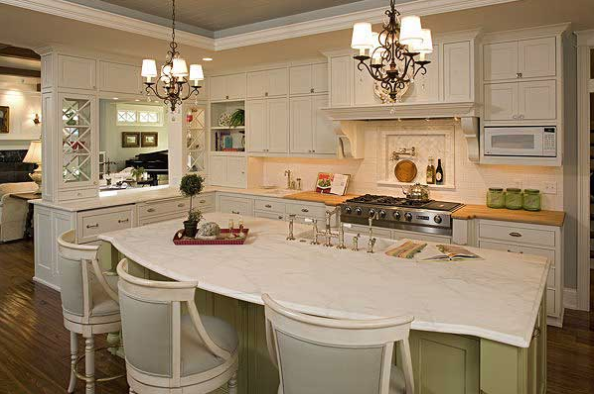 Hampton house plans: Hampton style house plan interior kitchen with a large island, chandeliers, and coffered ceiling | Monster House Plans