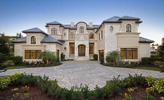 Italian house plans: Italian style house plan exterior with a stucco facade, tile roof, and arched windows | Monster House Plans