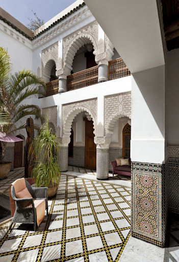 Mediterranean house plans: Moroccan-influenced courtyard with horseshoe arches and patterned tile work | Monster House Plans